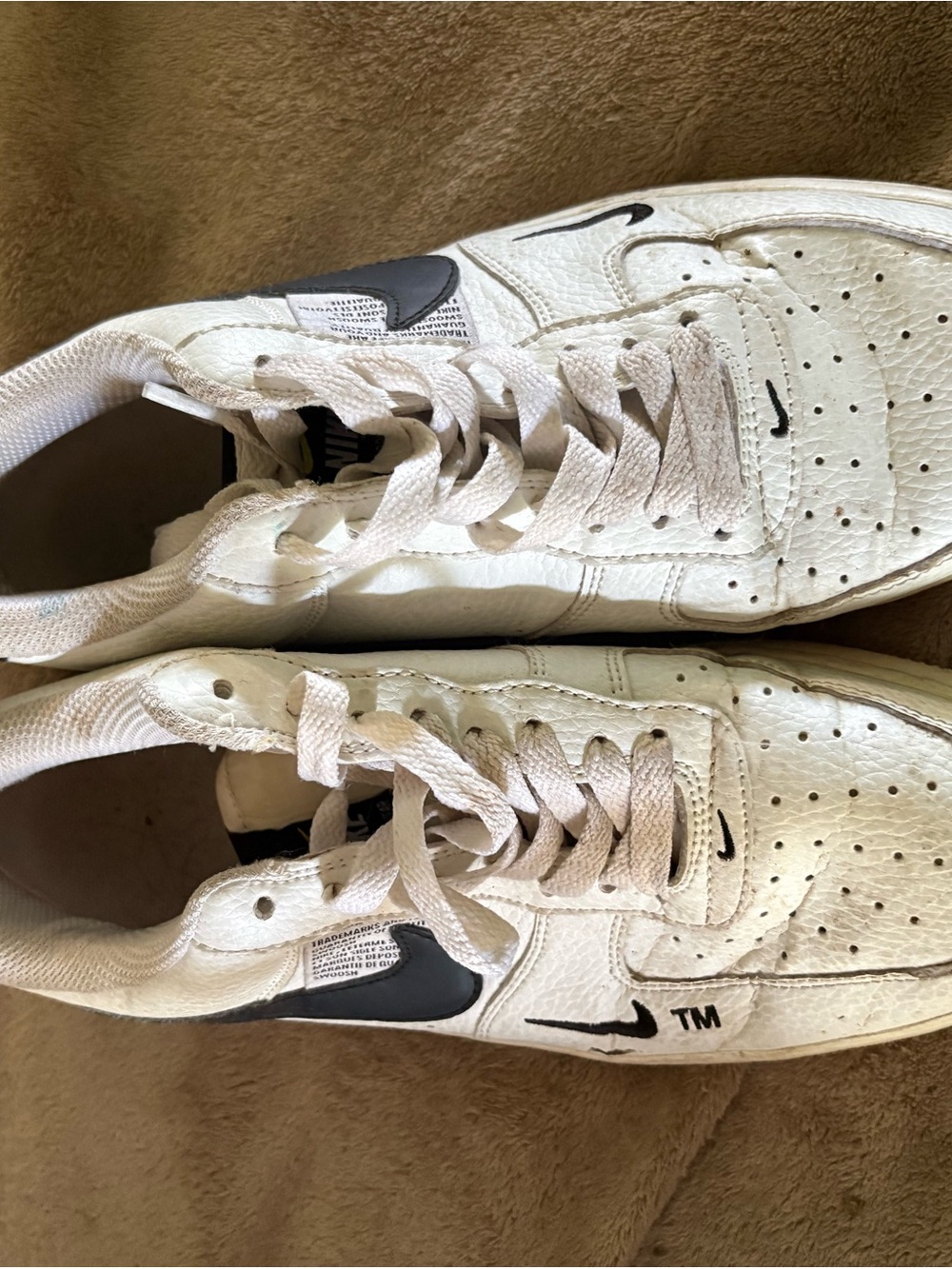 Nike White Leather Sneakers with Black Swoosh Accents